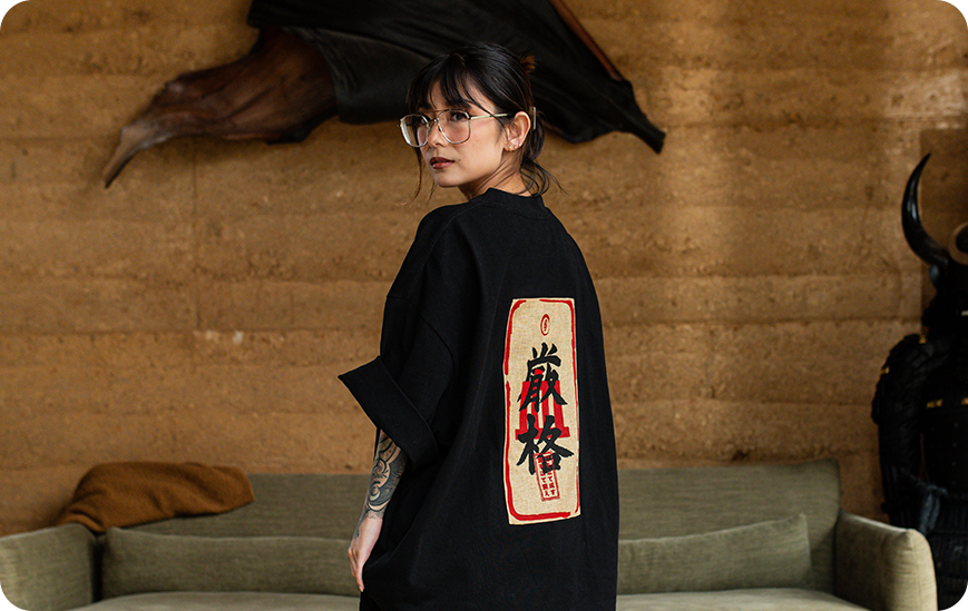 Black kimono-style garment with red and white text on the back.